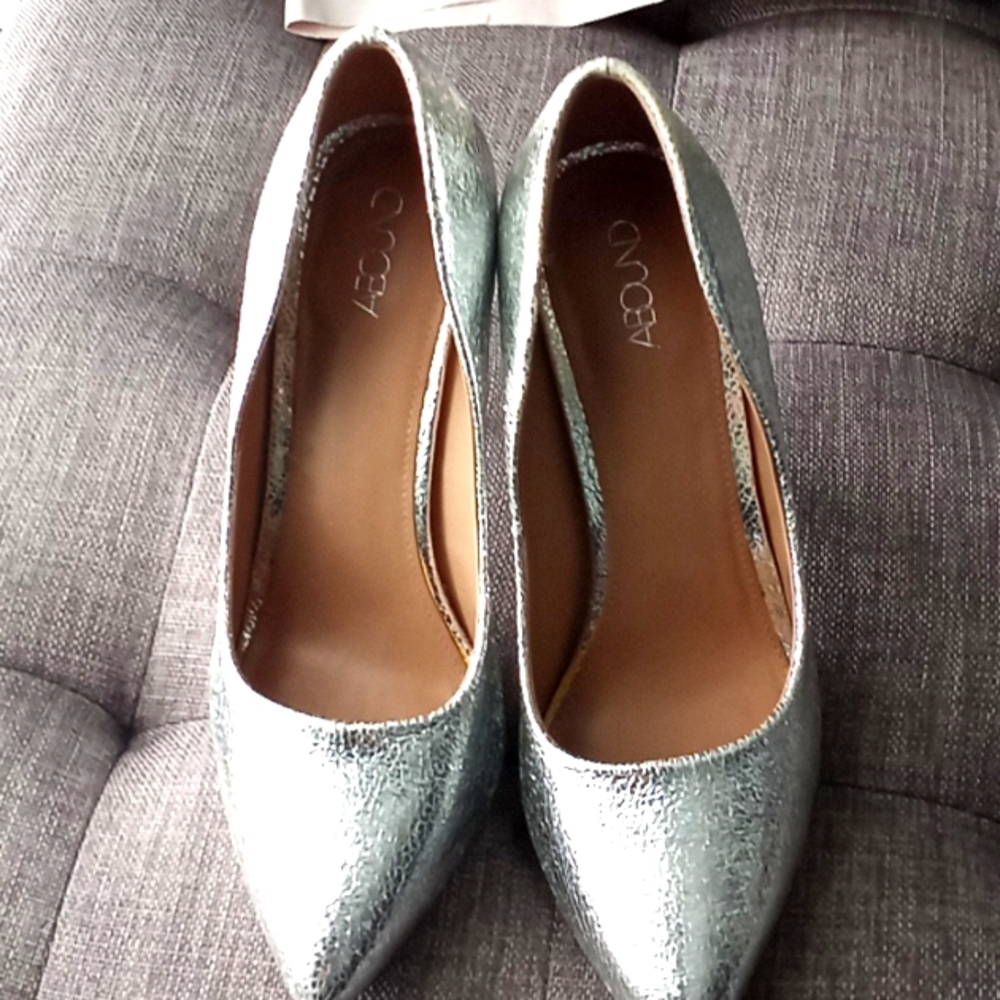 Abound silver here pumps. Never worn outside.